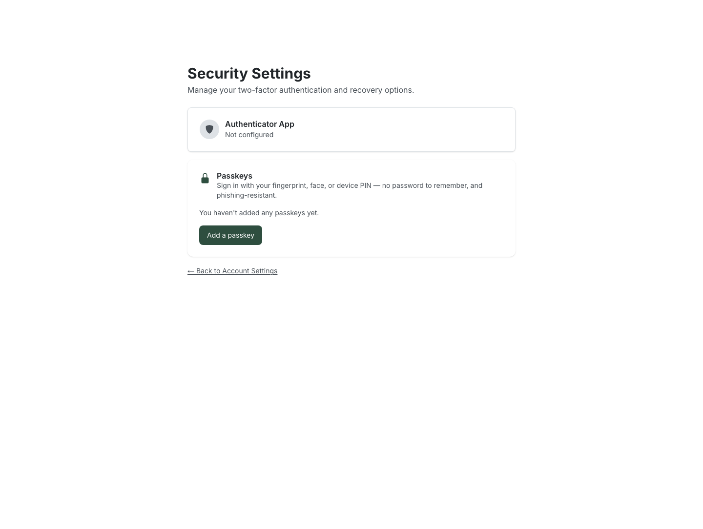 The Security Settings page showing an "Authenticator App — Not configured" card and a "Passkeys" card with the description "Sign in with your fingerprint, face, or device PIN — no password to remember, and phishing-resistant", the text "You haven't added any passkeys yet", and an "Add a passkey" button