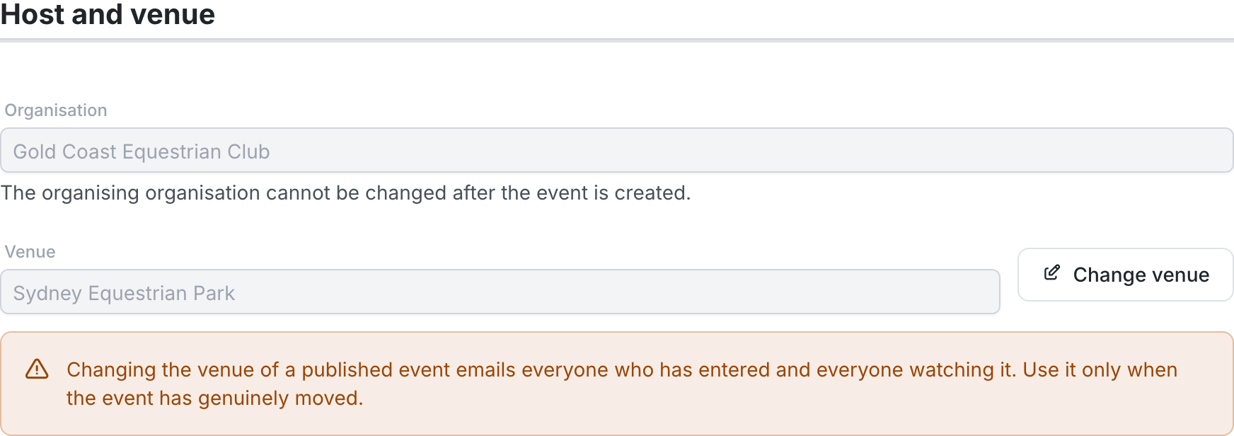 The Host and venue section of a published event: a read-only Organisation field, a greyed-out Venue field showing "Sydney Equestrian Park" with a Change venue button, and an amber warning that changing the venue emails everyone who has entered and everyone watching