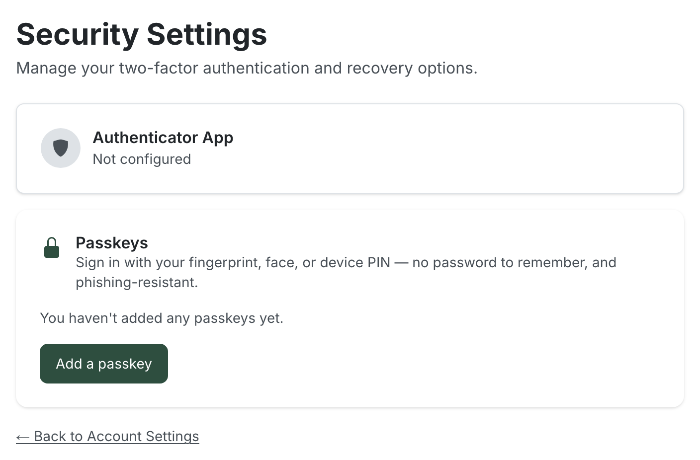 The Security Settings page showing an "Authenticator App — Not configured" card and a "Passkeys" card with the description "Sign in with your fingerprint, face, or device PIN — no password to remember, and phishing-resistant", the text "You haven't added any passkeys yet", and an "Add a passkey" button