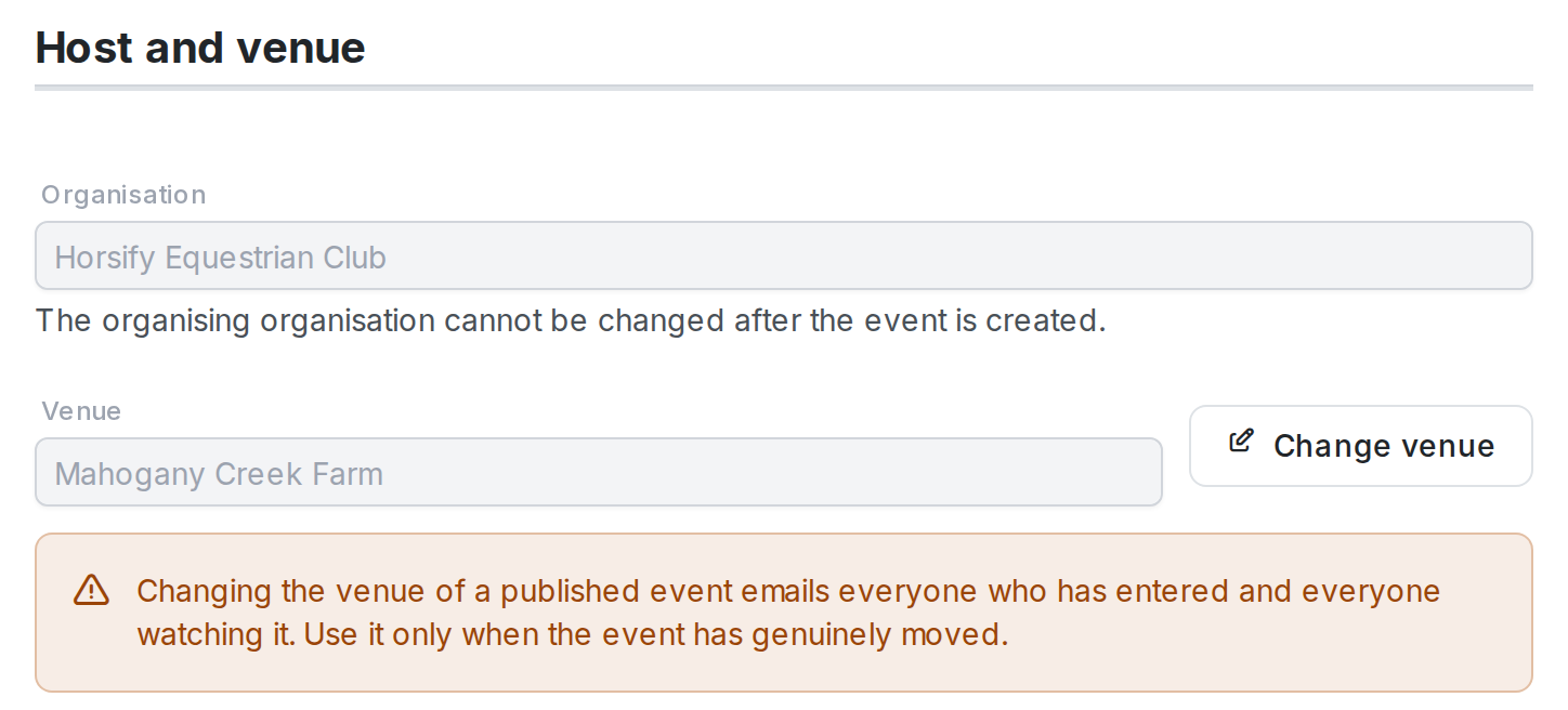 The Host and venue section of a published event: a read-only Organisation field, a greyed-out Venue field showing "Mahogany Creek Farm" with a Change venue button, and an amber warning that changing the venue emails everyone who has entered and everyone watching
