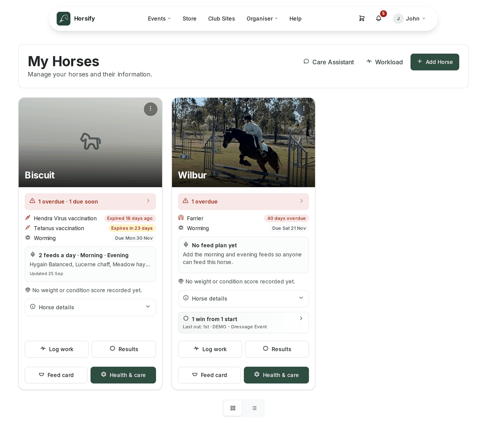 The My Horses page with Care Assistant, Workload and Add Horse buttons at the top and two horse cards, Biscuit and Wilbur. Each card has a three-dots menu in its top corner, a care strip (Biscuit "1 overdue · 1 due soon", Wilbur "1 overdue") listing what is due, a feed panel, a weight and condition line, a collapsed "Horse details" disclosure, and Log work, Results, Feed card and Health & care buttons